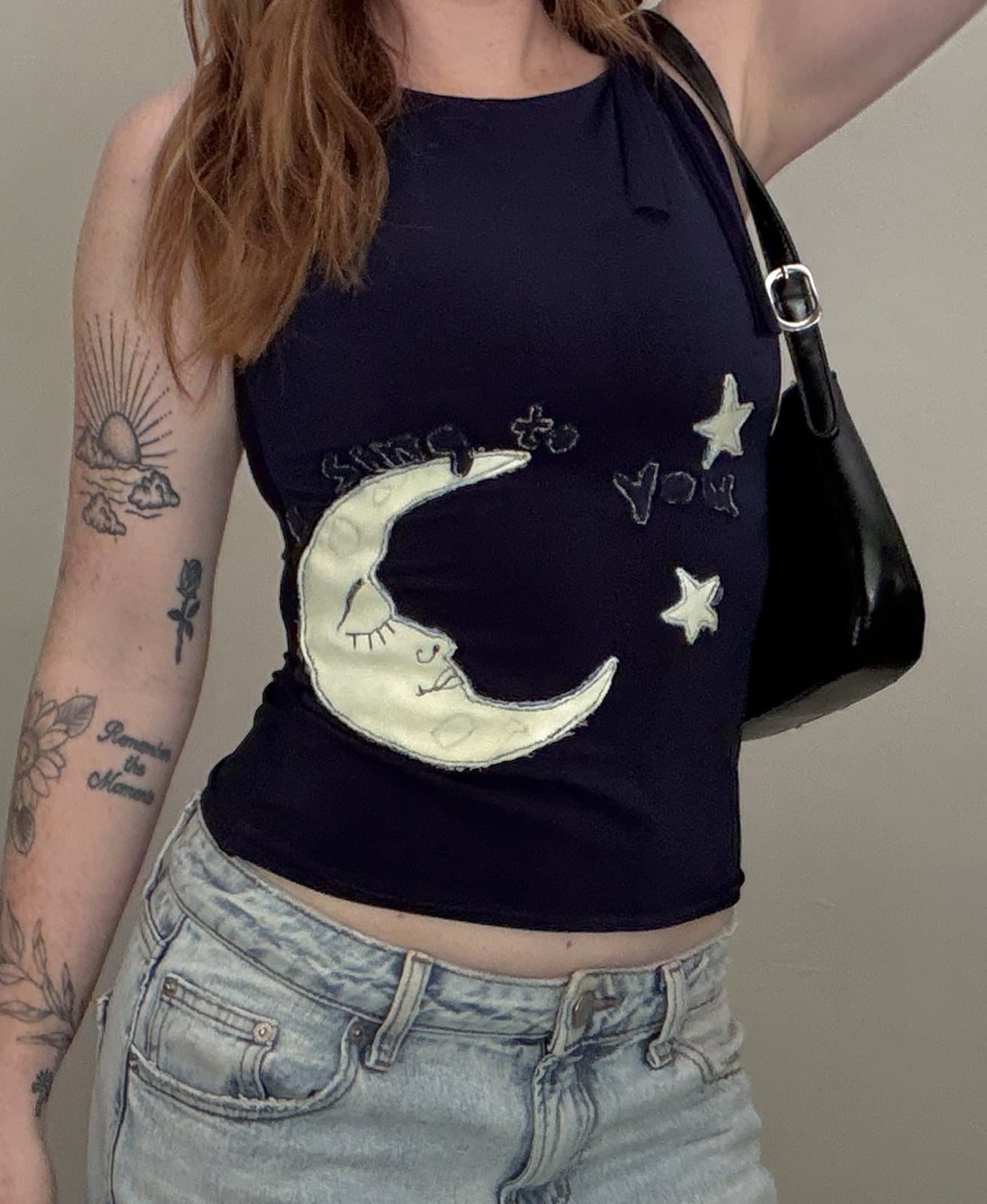 Navy tank top with a patchwork crescent moon and stars